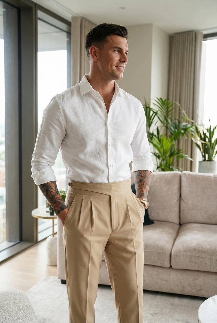 Men's tailored cream trousers by FJØRNA, showcasing a slim fit design with front pockets and a smooth fabric finish.