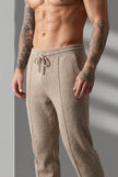 Men's beige merino wool trousers by FJØRNA, showcasing a tailored fit and soft textured fabric.