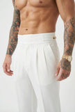 Men's tailored white trousers by FJØRNA, featuring a sleek fit and modern design, shown on a model.