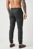 FJØRNA slim-fit black men's trousers displayed on a hanger with a clean, modern design and tailored fit.