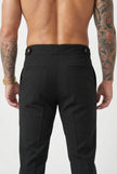 Men's tailored black trousers by FJØRNA, featuring a slim fit and classic design, shown on a model.