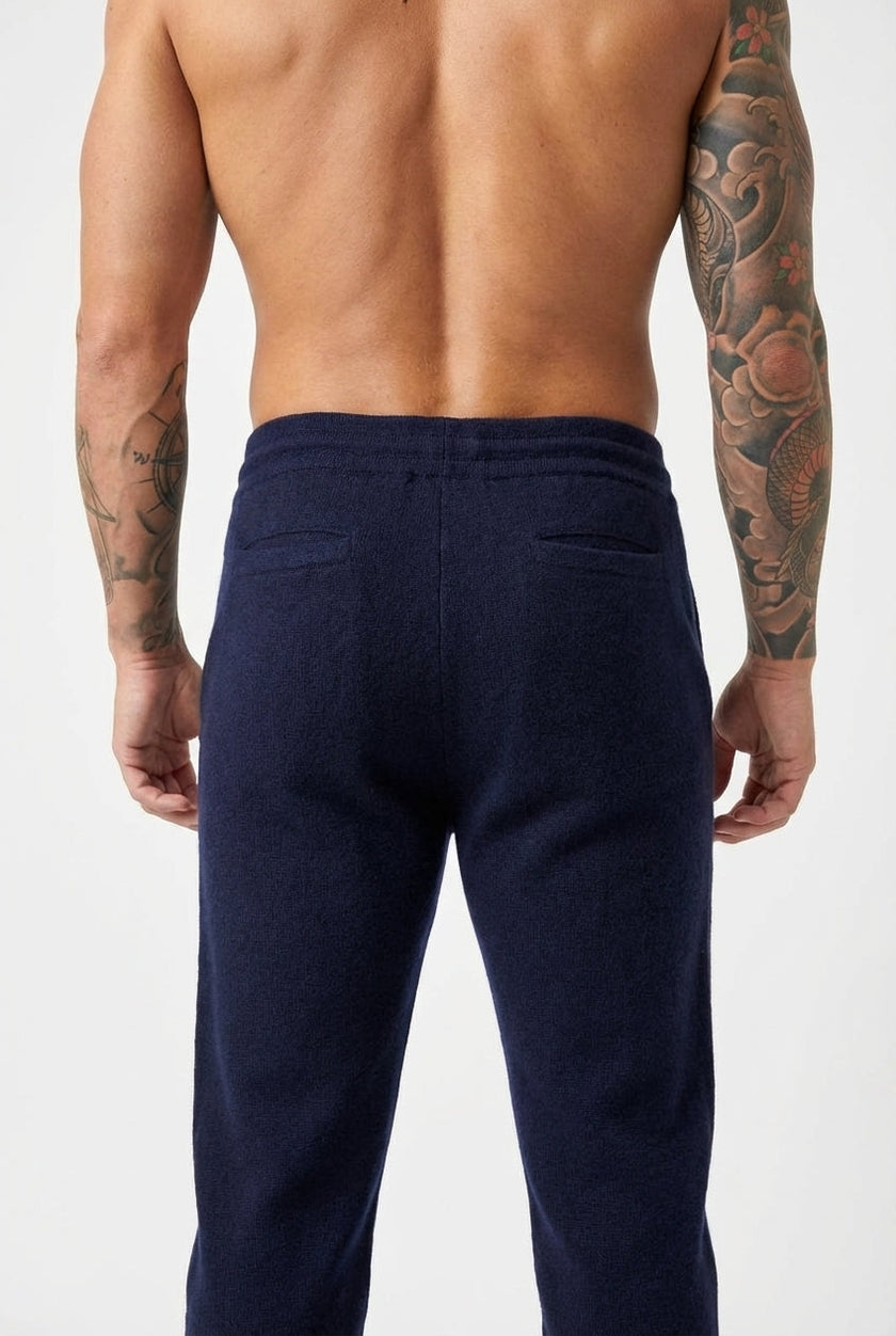Men's navy Merino wool trousers by FJØRNA, showcasing a tailored fit and smooth fabric in a stylish design.