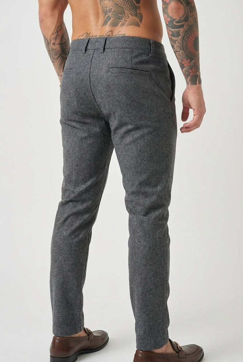 Men's slim-fit trousers in light grey from FJØRNA, showcasing a tailored design and comfortable fit in a close-up image.