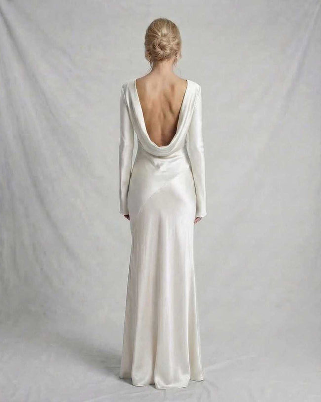 FJØRNA ivory satin slim fit maxi dress with low draped back, perfect for evening occasions and elegant events.