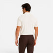 Men's striped knitted polo shirt by FJØRNA, lightweight and breathable slim fit summer shirt, shown on a model.