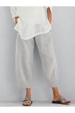 FJØRNA women's lightweight summer trousers with tapered fit, elastic waist, and cropped length, shown in a loose-fit style.