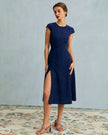 FJØRNA polka dot cutout cap-sleeve midi dress with round neck, perfect for summer business occasions.