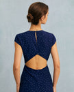 FJØRNA polka dot cutout cap-sleeve midi dress with round neck, perfect for summer business or casual occasions.