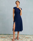 Navy polka dot midi dress for women by FJØRNA featuring a round neckline and stylish cutout detail.