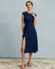 Navy polka dot cutout cap-sleeve midi dress by FJØRNA, featuring a round neckline and stylish summer business dress design.