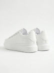 Back view of FJØRNA white lace-up men's minimalist trainers, designed for everyday style and casual wear.