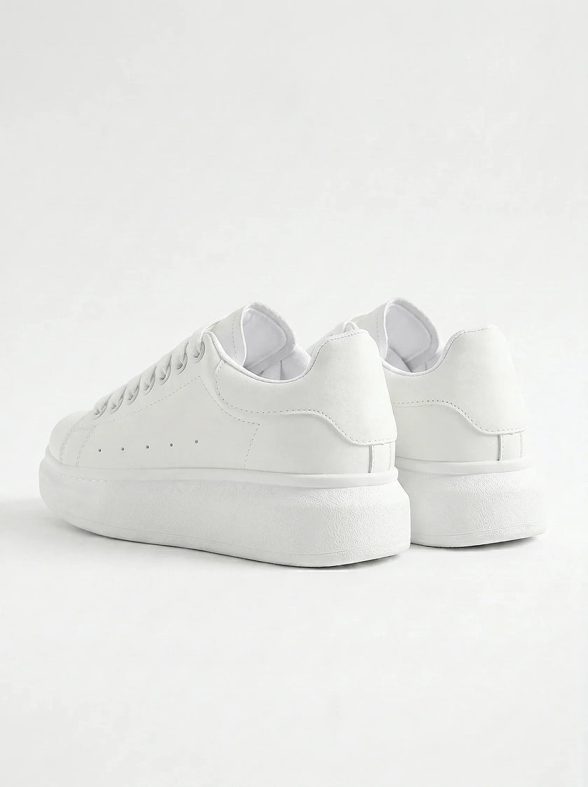 Back view of FJØRNA white lace-up men's minimalist trainers, designed for everyday style and casual wear.