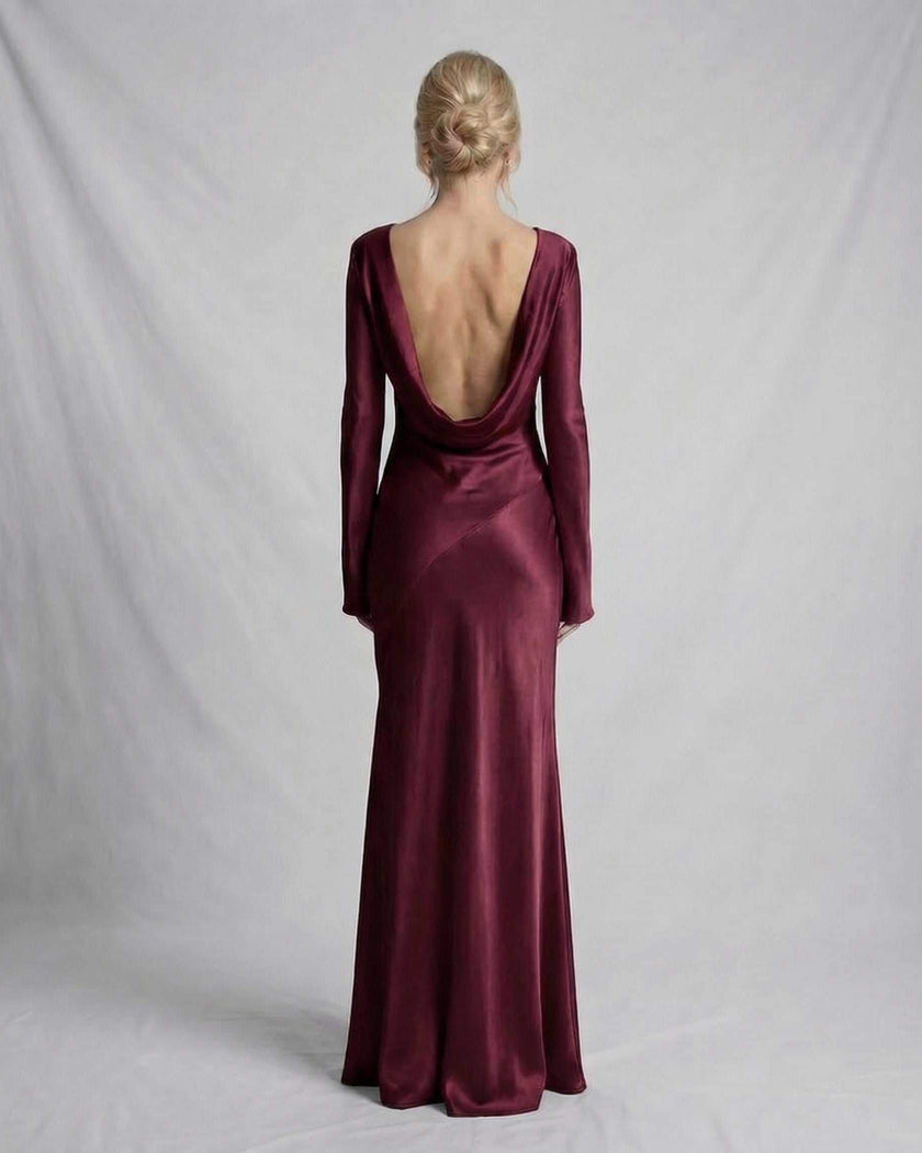 Black satin slim fit maxi dress by FJØRNA featuring a draped back and elegant design.