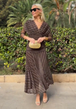 FJØRNA bohemian patterned V-neck mesh maxi dress with casual wedding style, featuring flowing fabric and intricate design details.