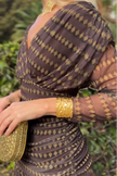 FJØRNA bohemian patterned V-neck mesh maxi dress with casual wedding style, featuring flowing fabric and intricate print.