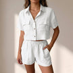 White women's two-piece summer co-ord set with relaxed fit and pockets by FJØRNA, perfect for casual warm-weather wear.