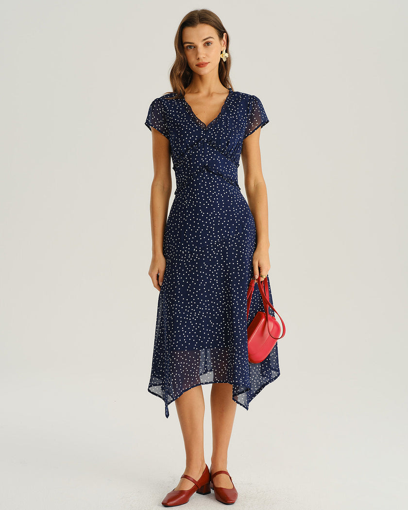 Navy polka dot chiffon V-neck midi dress by FJØRNA, perfect for wedding guests, with flowing fabric and elegant design.