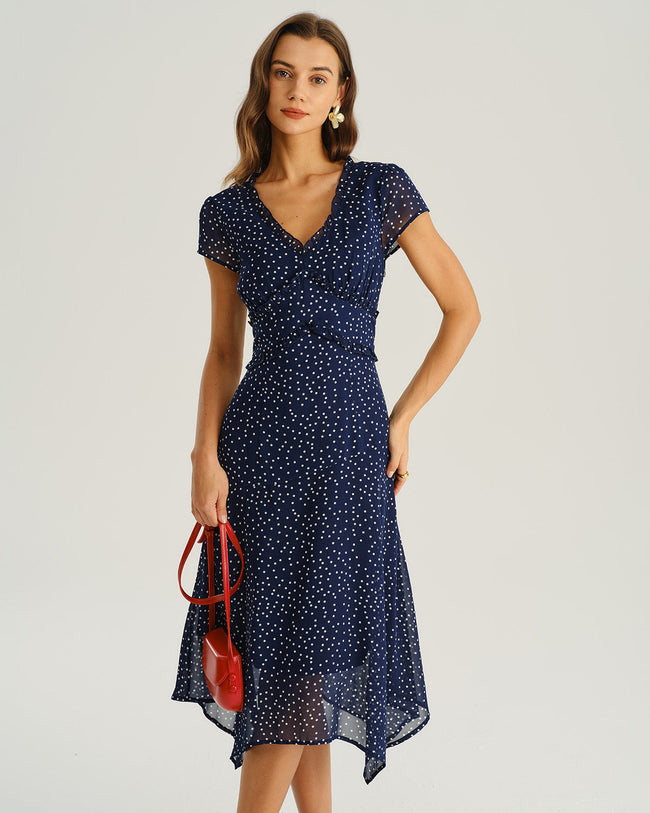 Navy polka dot chiffon V-neck midi dress by FJØRNA, perfect for wedding guests, featuring a flowing woven polyester fabric.