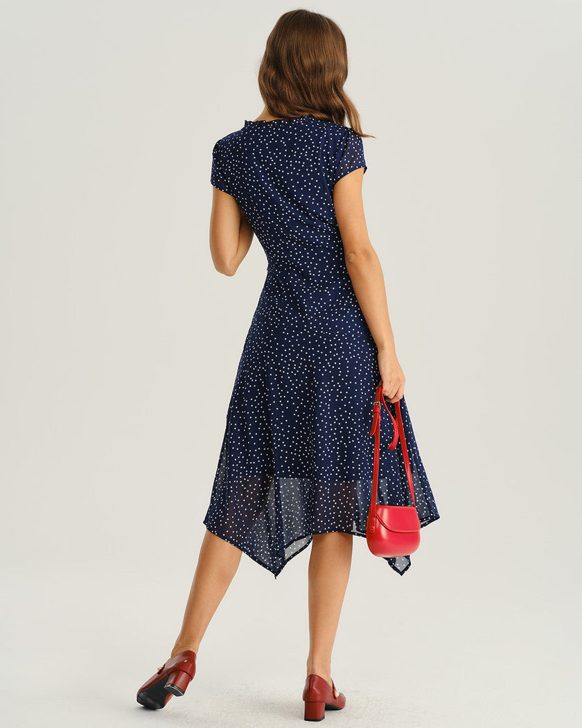 Navy polka dot chiffon V-neck midi dress by FJØRNA, featuring a flowing design perfect for wedding guests.