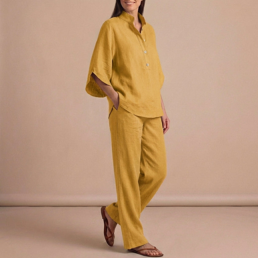 Yellow FJØRNA women's two-piece co-ord set with button-front top and matching pants, styled for a chic, elegant look.