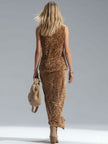 FJØRNA women's leopard print sleeveless vest and velvet split-hem skirt set, stylish fashion ensemble with bold animal print.